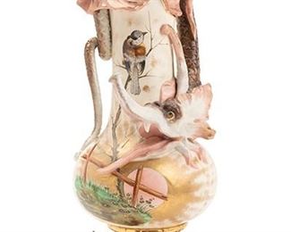 2252
An Amphora Pitcher With Dragon And Birds
First-quarter 20th Century
Marked: Eichwald / A / 430
The pitcher with shell pourer, a dragon handle and scaled feet, and painted birds and bees
18" H x 7" W x 6.5" D
Estimate: $600 - $800