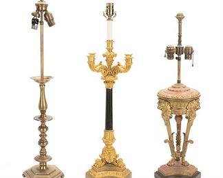 2256
A Group Of Three Table Lamps
First-quarter 20th Century
Comprising one gilt-bronze ornamental lamp with figural lion masks and foliate motifs on a tri-form base (30.25" H x 8" Dia.), one gilt-bronze candelabra-style lamp issuing four scrolling arms with foliate motifs on a tri-form base (31.75" H x 10.5" Dia.), and one brass lamp with knopped column on a hexagonal base (34" H x 6.5" Dia.), 3 pieces
Estimate: $200 - $300