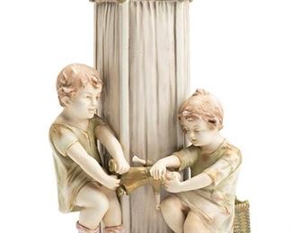 2257
An Amphora Vase With Young Children
Circa 1905-1910; Teplitz, Austria
Marked for Amphora Works Turn / Amphora Riessner & Kessel Turn-Teplitz: [Crown] / Amphora / Austria / 20083 / 21
The two children playing tug-of-war with a doll in front of a rectangular column
13.25" H x 8.5" W x 5.25" D
Estimate: $400 - $600