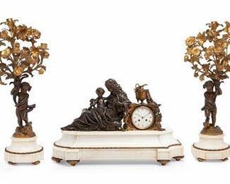 2261
A French Figural Bronze And Marble Clock And Garniture Set
19th Century
Clock marked to dial: Faberge / A Montpelier; Further stamped to mechanism: Medaille de Bronze / 3770 / 6 / 9
The clock set in a bronze sphinx mount with urn and scene of a woman and cherub on a white marble base together with two six-light candelabra each with a cherub-shaped stem and floral arms on white marble base, 3 pieces
Clock: 17.5" H x 28" W x 10" D; Each candelabrum approximately: 26.25" H x 12.5" W x 12" D
Estimate: $3,000 - $4,000