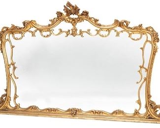 2268
A Continental Rococo-Style Giltwood Wall Mirror
Late 19th/early 20th Century
The carved open-work foliate cornice atop a carved rectangular frame with rocaille motifs and rounded corners on a straight base enclosing a rectangular mirror
48.75" H x 89.5" W x 6" D
Estimate: $400 - $600