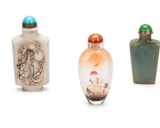 2275
A Group Of Chinese Snuff Bottles
20th Century
Comprising a carved white stone bottle with figural motifs and Chinese characters, a carved Hetian nephrite jade bottle with floral motifs and open-work details, a tapered jade bottle, a red glass bottle with enameled floral decorations, and an ovoid glass bottle with painted cranes, 5 pieces
Largest: 3.625" H x 1.75" W x .625" D; Smallest: 2.25" H x 1.875" W x .625" D
Estimate: $300 - $500