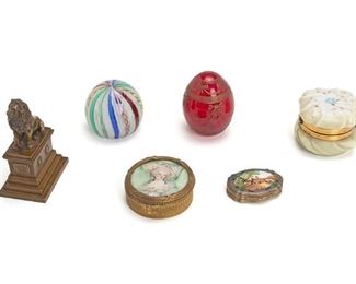 2283
Six Table Objects
First-half 20th Century
Spurious signature to red paperweight: Faberge
Comprising two glass paperweights, a small bronze lion sculpture, and three small vanity boxes, 6 pieces
Largest: 5" H x 3.125" W x 2.375" D
Estimate: $300 - $500