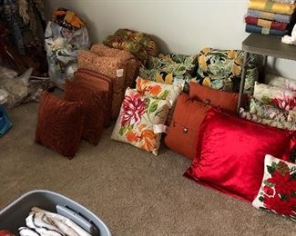 Some of the large quantity of throw pillows 