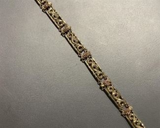 10 K rose link 7 inch bracelet. Weighs 6.9g.