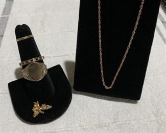 Lot includes gf signet ring, gf baby ring, Avon necklace, gp angel, gp blue and clear stone band.