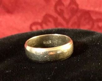 14 k white gold band. Size 8 1/2 to 9 and weighs 4.9 grams.