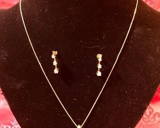 14 K Gold necklace (20 inch) with 3-Diamond pendants and matching earrings. Weighs 6.4 grams.