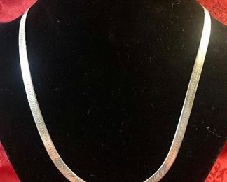 Sterling Silver Herring Bone chain. Measures 20 inches and weighs 15.7 grams.