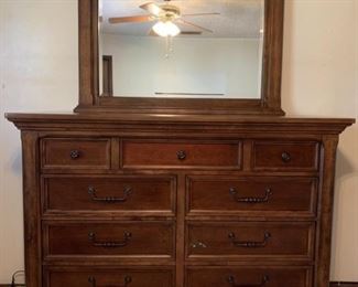 Millennium dresser with mirror sold by Ashley Furniture. Not including the mirror, the dresser measures 62 x 19 x 43. The mirror measures 47 x 35. 