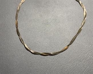 14k twist bracelet. Measures 7 inches and weighs 1.0g. 
