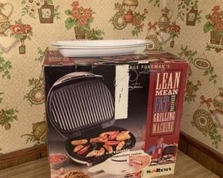 New George Foreman Grilling Machine still in box. Lot also includes two drip trays