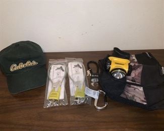 This lot includes 2 child safe locks, 1 Weatherby lock, 1 energizer head lamp, 2 Ameristep pouches, 1 Secure line carabiner, and 1 Cabela’s hat. All locks come with keys.