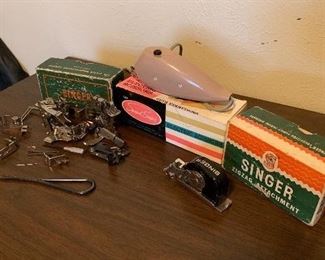 Singer sewing machine parts and electric scissors.