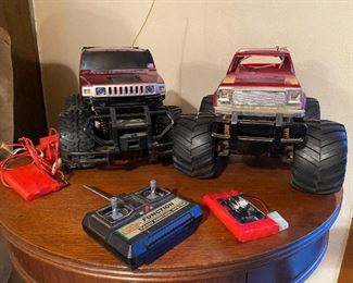 2 Nikki Remote Controlled R/C Trucks. Lot includes only 1 Remote Control, but 3 batters with 1 charger. Remote has break at top of antenna. 