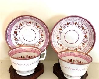 $45 Pair pink and white cups and saucers with wood stands.  each  5.5" W, 5.5" D, 6.5" H.