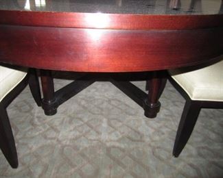 DETAIL OF TABLE AND LEGS OF DINING ROOM TABLE