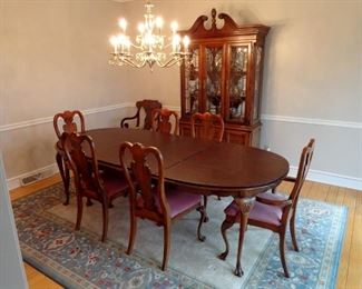 American Drew Cherry dining room suite. Includes table with two extension leaves, six chairs and Dansk pads and cherry Federal style china cabinet.