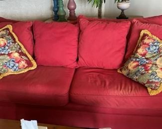 Double Cushioned Red Sofa.