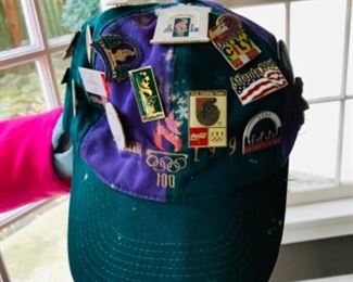 Atlanta Olympics hat covered in pins