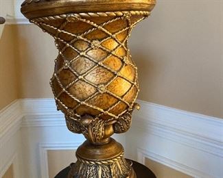 Close up of golden vase details. 