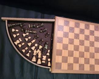 Chess board with hideaway pieces 