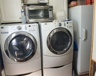 Maytag front end washer and electric dryer with pedestals 
