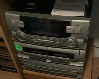 The stereo, speakers on cabinet.