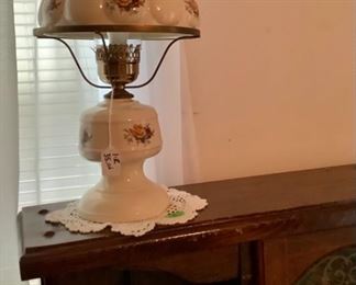 Just one of the white glass lamps with the pink roses. There is another one matching this one.