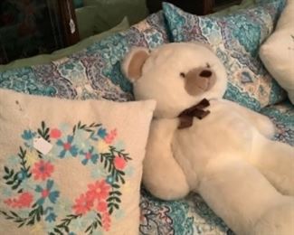 The beautiful bed spread on Queen bed and pretty pillows.