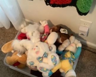 Bucket of stuffed animals.
