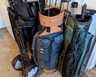 Tons of golf clubs and accessories