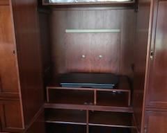 Inside of Armoire - Pull out Swivel Shelf for T.V.  Double doors on top push back into cabinet. 