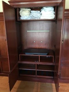 Inside of Armoire - Pull out Swivel Shelf for T.V.  Double doors on top push back into cabinet. 