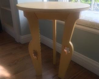 $75 -- Fanciful round wood side table in a soft yellow finish with curved cutout legs.  Excellent condition.   Diameter 24", height 29".  