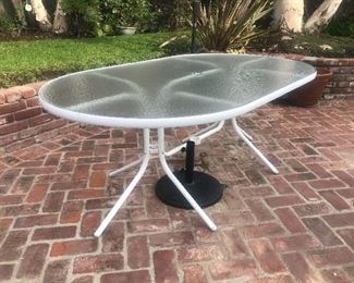 $75 -- Oval patio table with textured glass.  Excellent condition.  Length 72".  