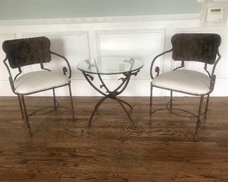 $350 Set of 3 -- Wrought iron sunroom (or patio) set.  Beveled glass top.  Quality construction throughout and in excellent condition.  Table diameter 24" x height 22".  Chairs height 31" x width 20".  