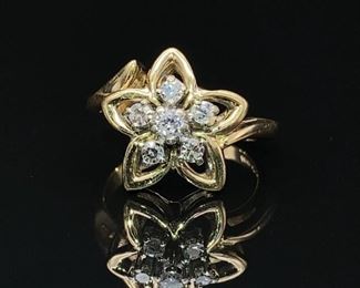 Star Shaped Diamond Cluster Estate Ring in 14k Gold. A .35 Carat weight ring in size 5 (can be resized).

Retail Estimate: $1999
