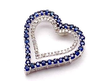 Natural blue Sapphire and Diamond heart estate pendant in 10k white gold weighing 1.77 grams  Chain not included. 

Retail Estimate: $2150