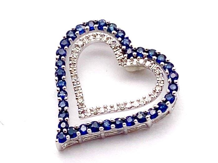 Natural blue Sapphire and Diamond heart estate pendant in 10k white gold weighing 1.77 grams  Chain not included. 

Retail Estimate: $2150