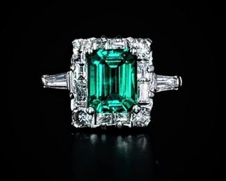 2.24 carat Emerald cut Chatham Emerald and Diamond estate ring in platinum. Weighs 7.16 grams.  Size 8 1/4 (can be resized). 

Estimated Retail: $10,500
