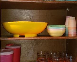 Two shelves of plastic, set of vintage glasses