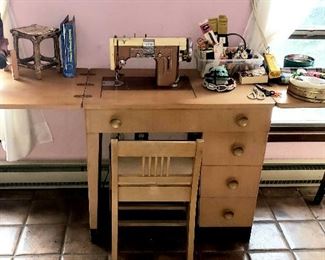Kenmore sewing machine in cabinet w/chair & sewing supplies