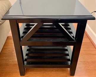$75 - Two shelf black end table.  24.5"H x 22"W x 22"D.  Small chip on top.