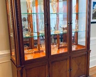 $1,250 - Ethan Allen Medallion Collection two-piece wood and glass shelf three door china cabinet. Overall 87"H x 67.5"W x 17.5"D.  Height of bottom piece 29.5"H; height of top piece 57.5"H