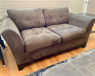 $350 - H.M. Richards tufted two cushion chocolate sofa.  32"H x 66"W x 39"D (seat height 18"H)