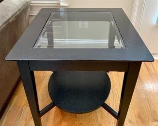 Pair of black painted wood with beveled glass insert end table with oval bottom shelf.  24.5"H x 24"W x 28"D.  As is.  Two of two.