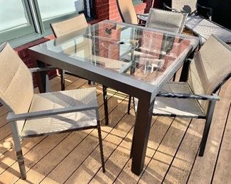 $200 - Glass top outdoor table; 39.5 “ x 39.5” x 30”H; Chairs 21.5” W x 34” H x 19” D.  Seats 17.5” H