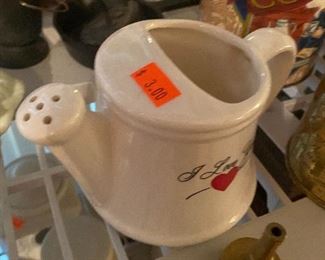 White ceramic watering can