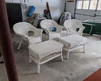 There are actually four chairs, plasticized wicker with two end tables with a shelf.  $200
